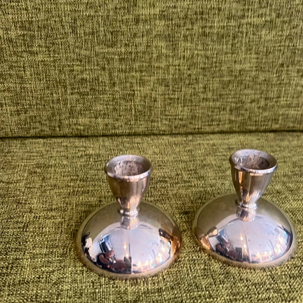 Set up to silver plated candlesticks holders.